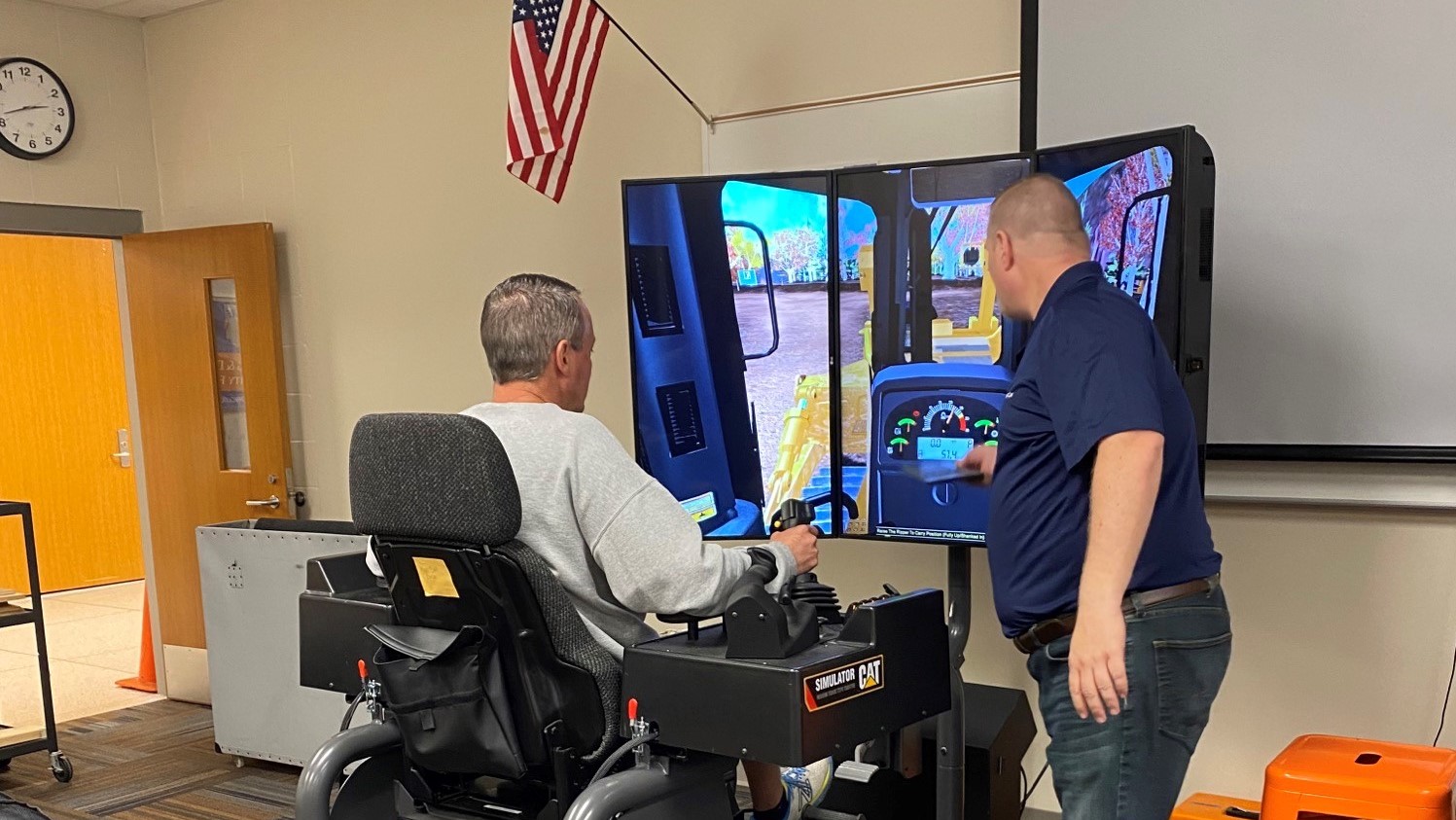 Virtual reality instructor shows student how to control the virtual excavator